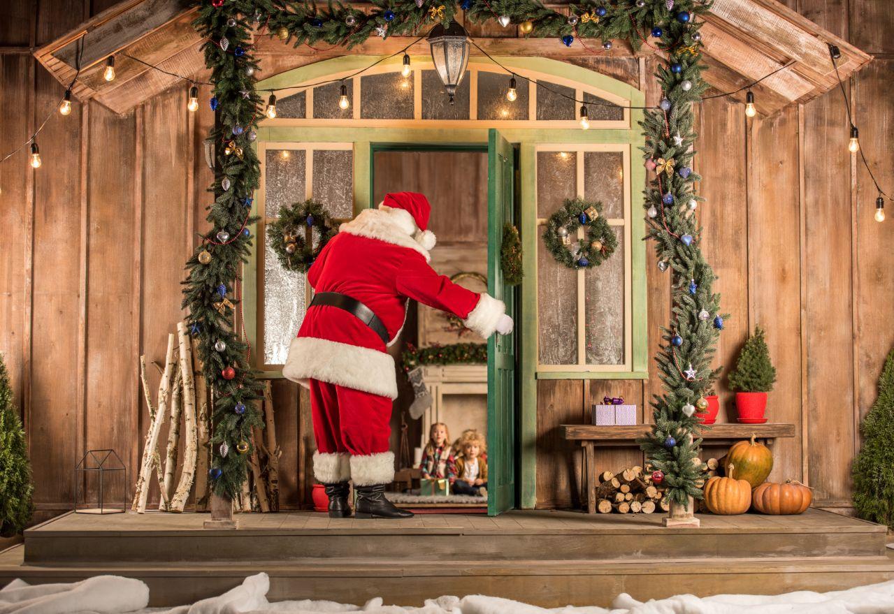 Merry Christmas Blessing Image with Santa Claus in front of Door