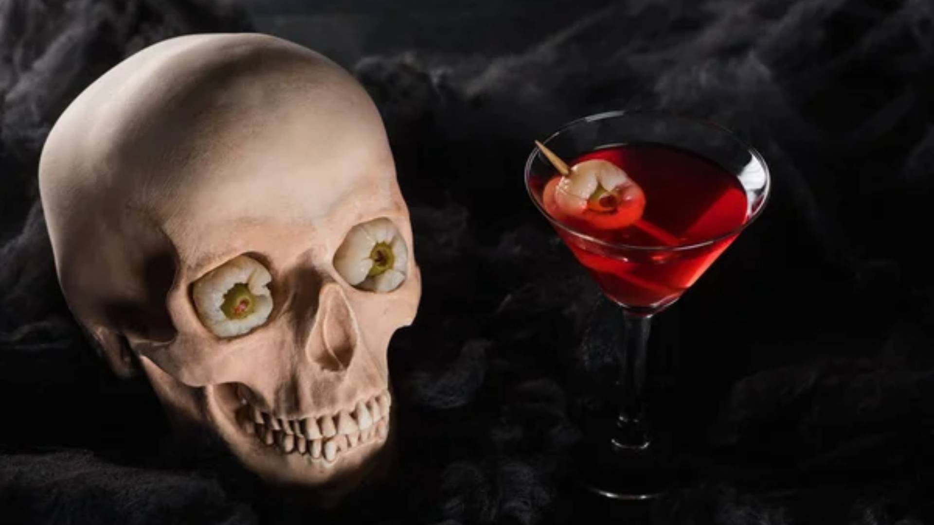 Scary skeleton and red wine background for Halloween