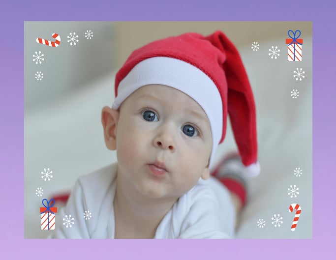 Add a Christmas frame to a picture of a baby wearing a Christmas hat