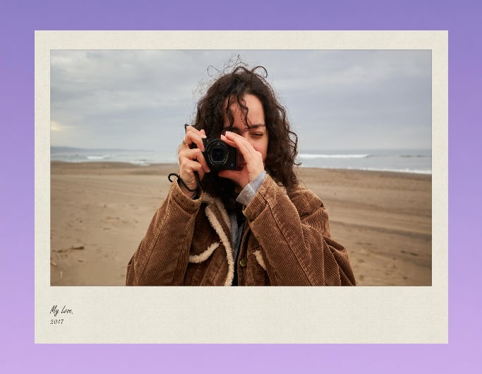 Add a vintage frame to a photo of a girl taking a photography