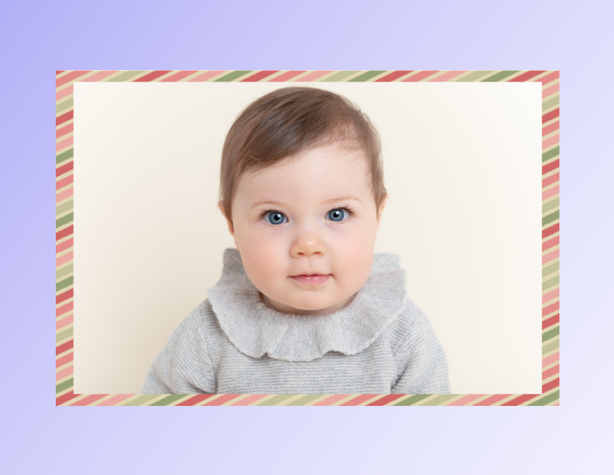 Add funky border to a photo of a baby with brown hair in a yellow bg