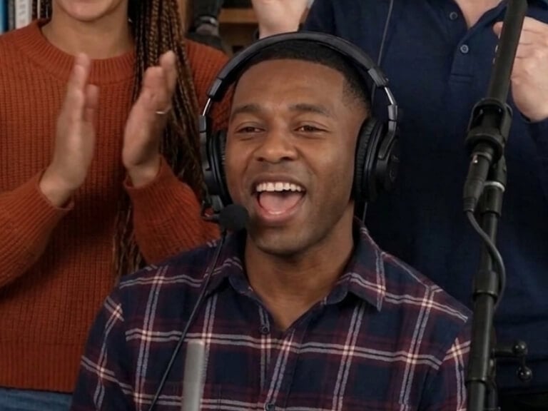 The close up shot of a backup singer in shirt