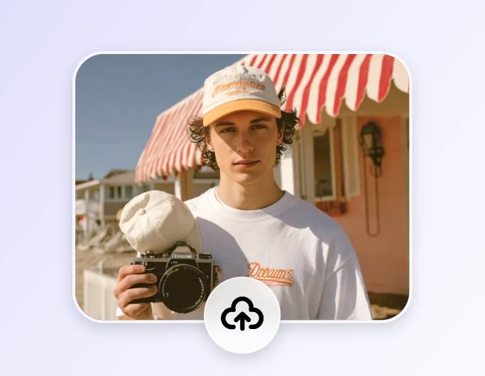 Upload a photo of a man holding a camera to fotor