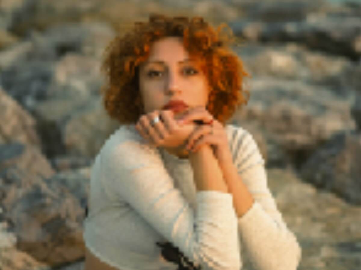 Upload a low quality and blurry photo of a woman to fotor ai photo enhancer