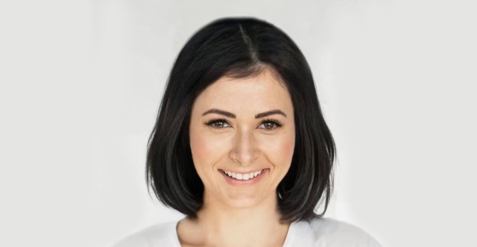 A smiling woman with shoulder length short hair