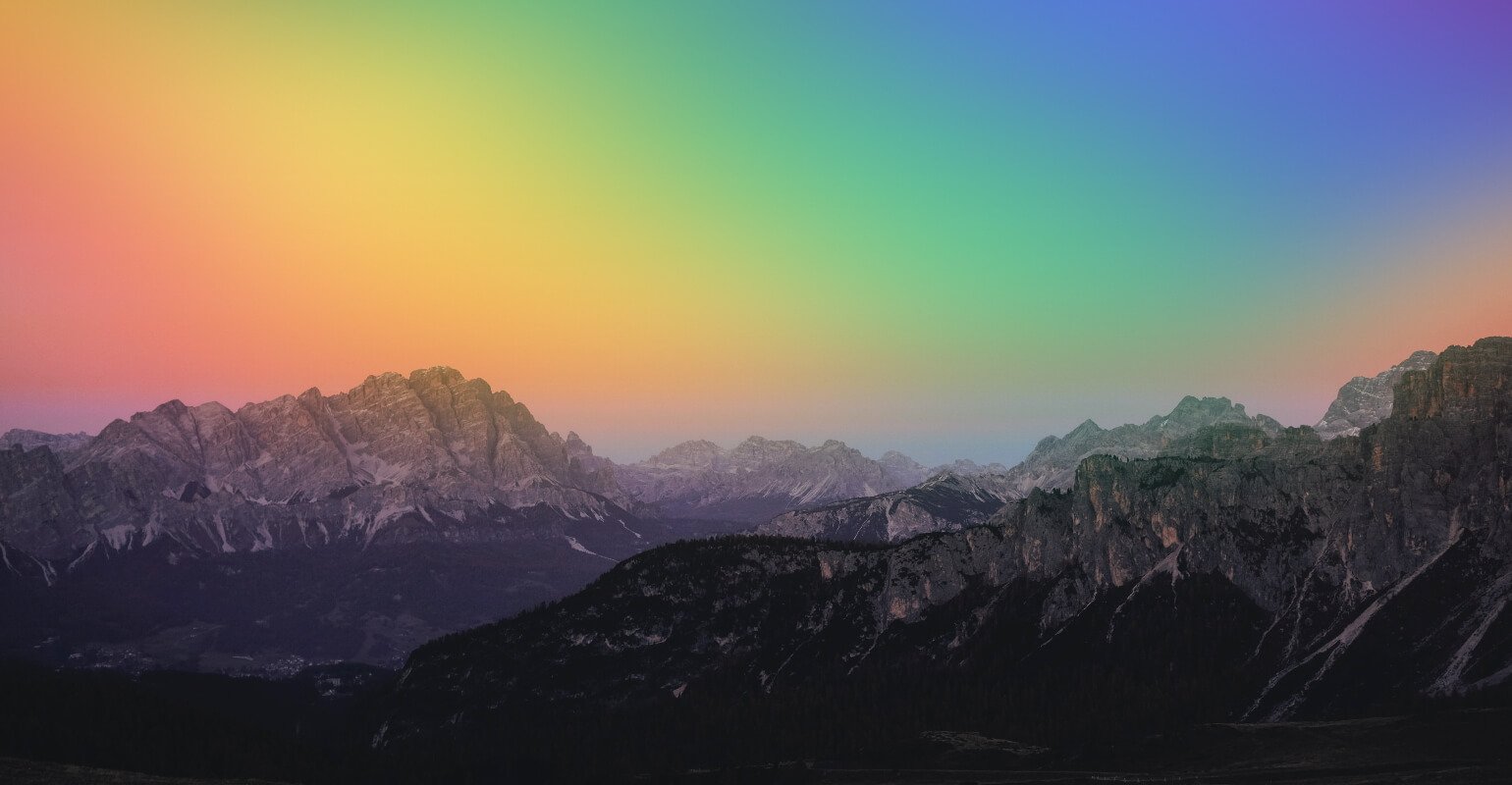 A sunset landscape photo with rainbow filter