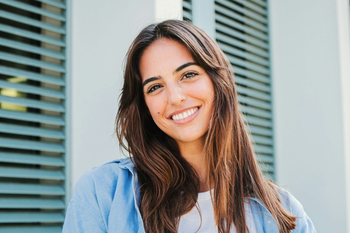After image of a smiling woman with enhanced expression using Fotor