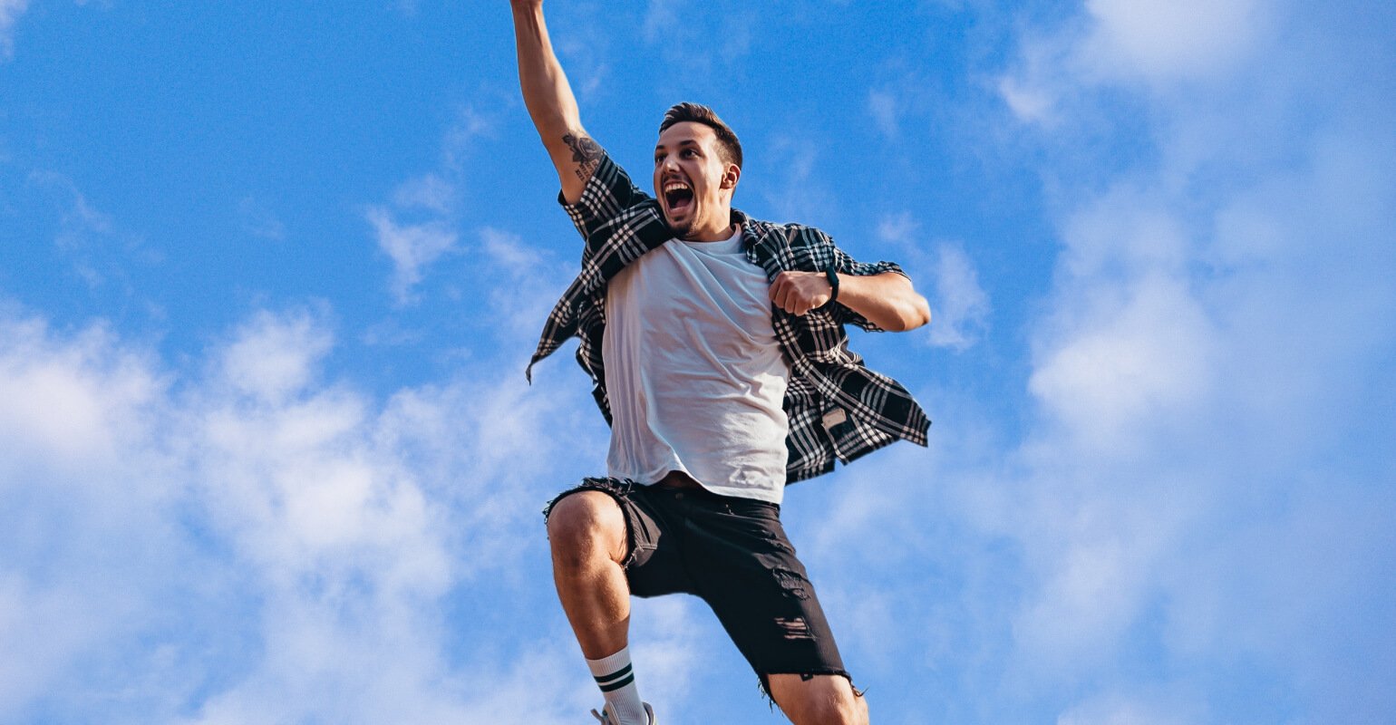 Jumping man image with blue sky background