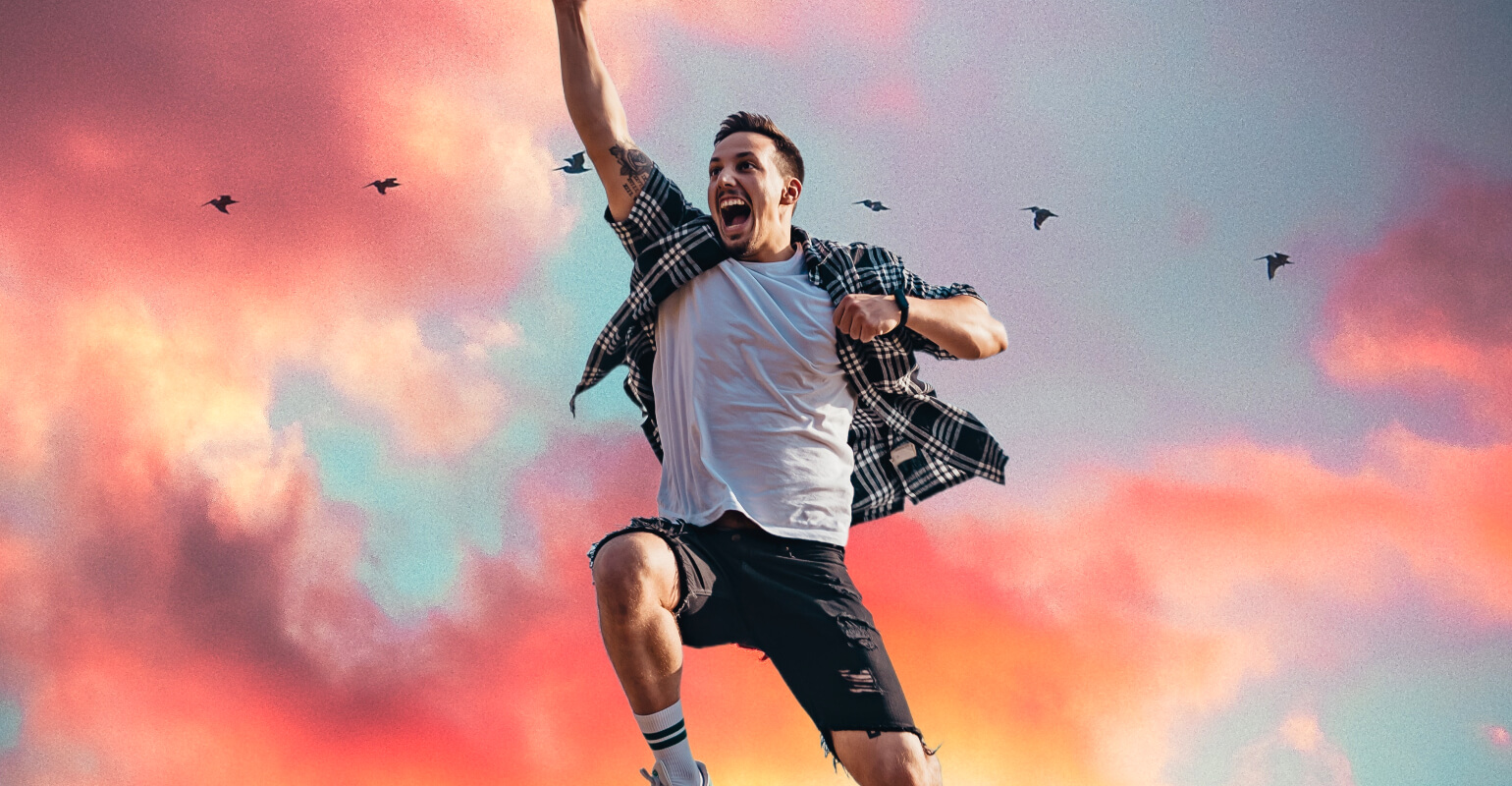 Jumping man image with pink sunset background