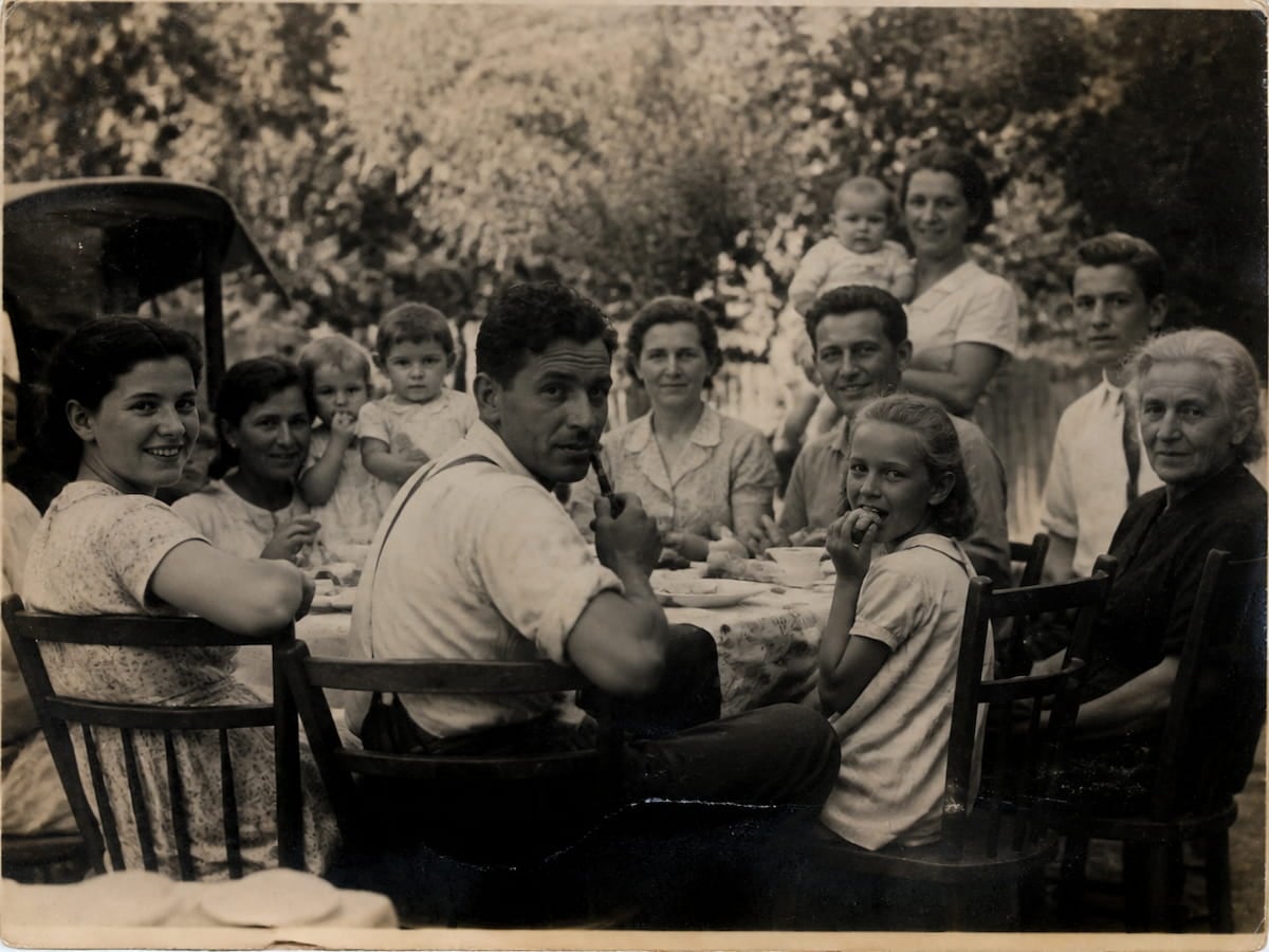 A black and white family gathering photo
