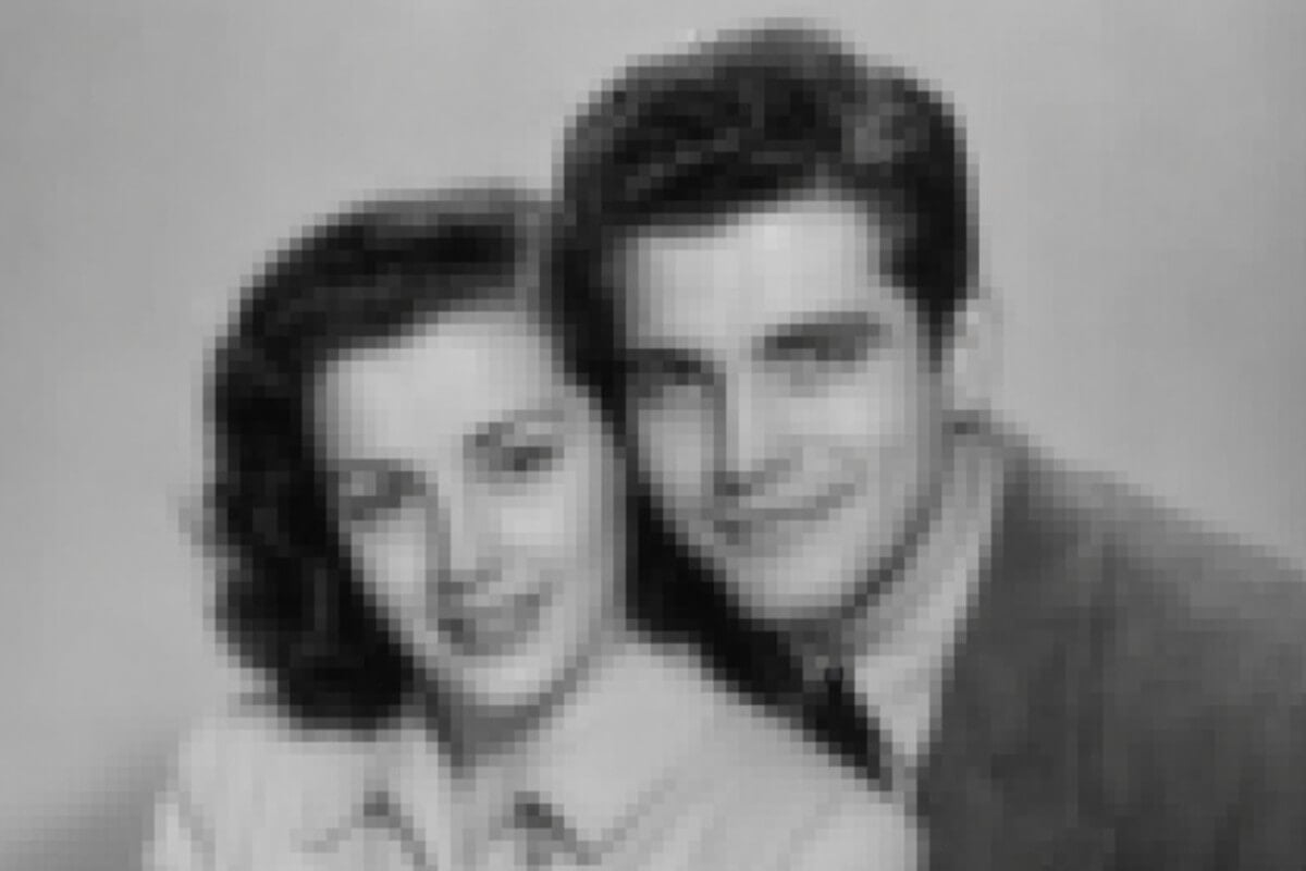 A blurry low quality old photo of a couple