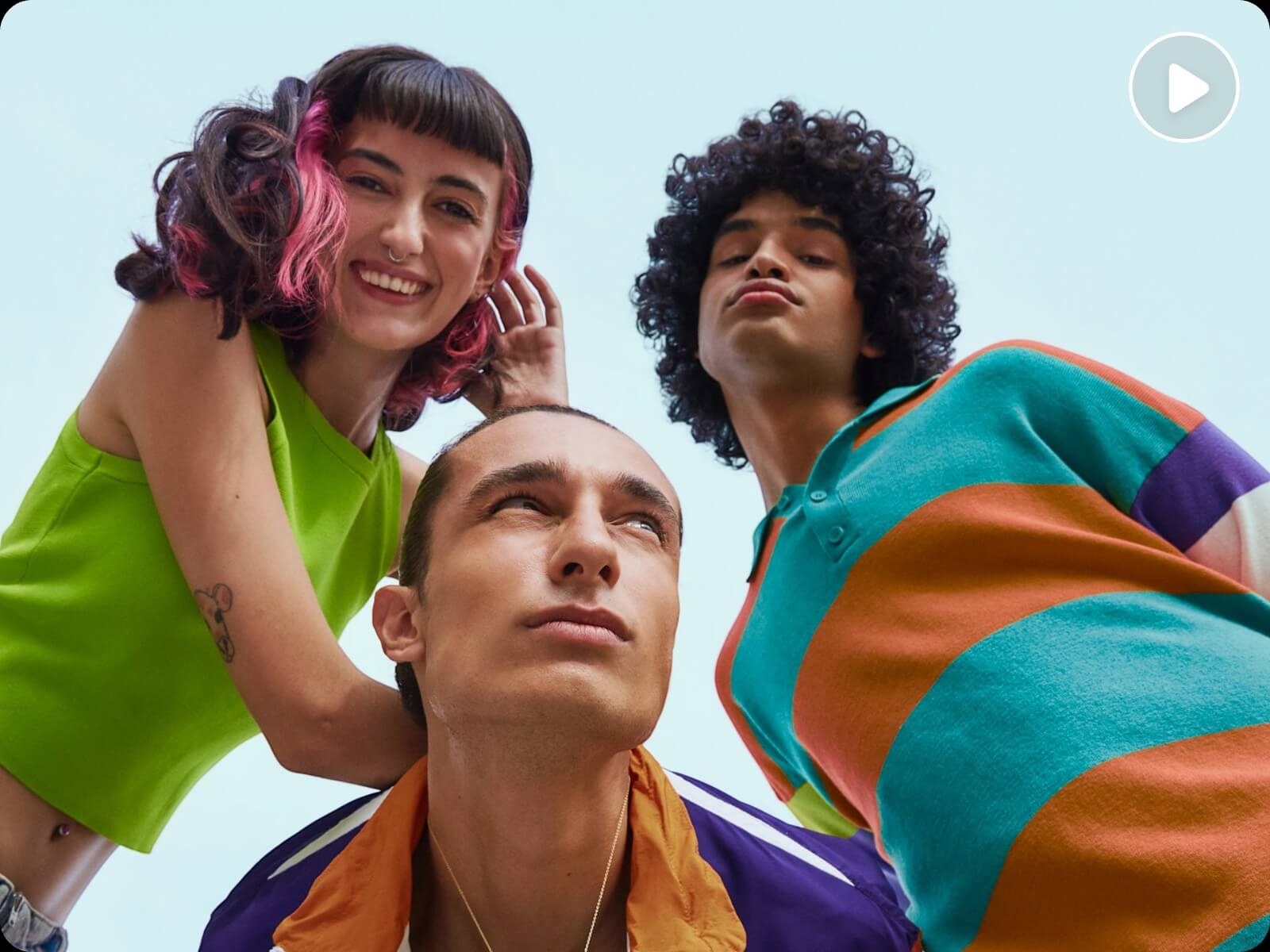 A photo of three people in t shirts