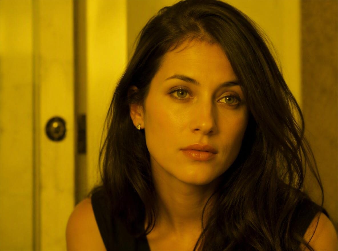A woman portrait with yellow color cast and unnatural warm skin tone