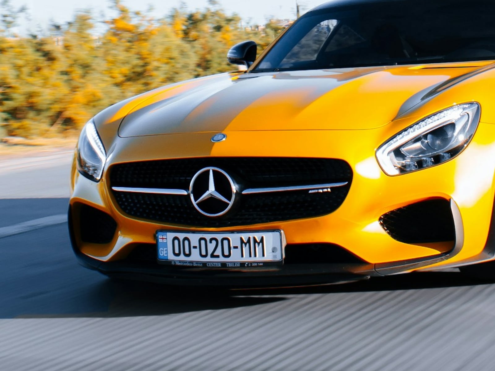 A yellow car before background blur