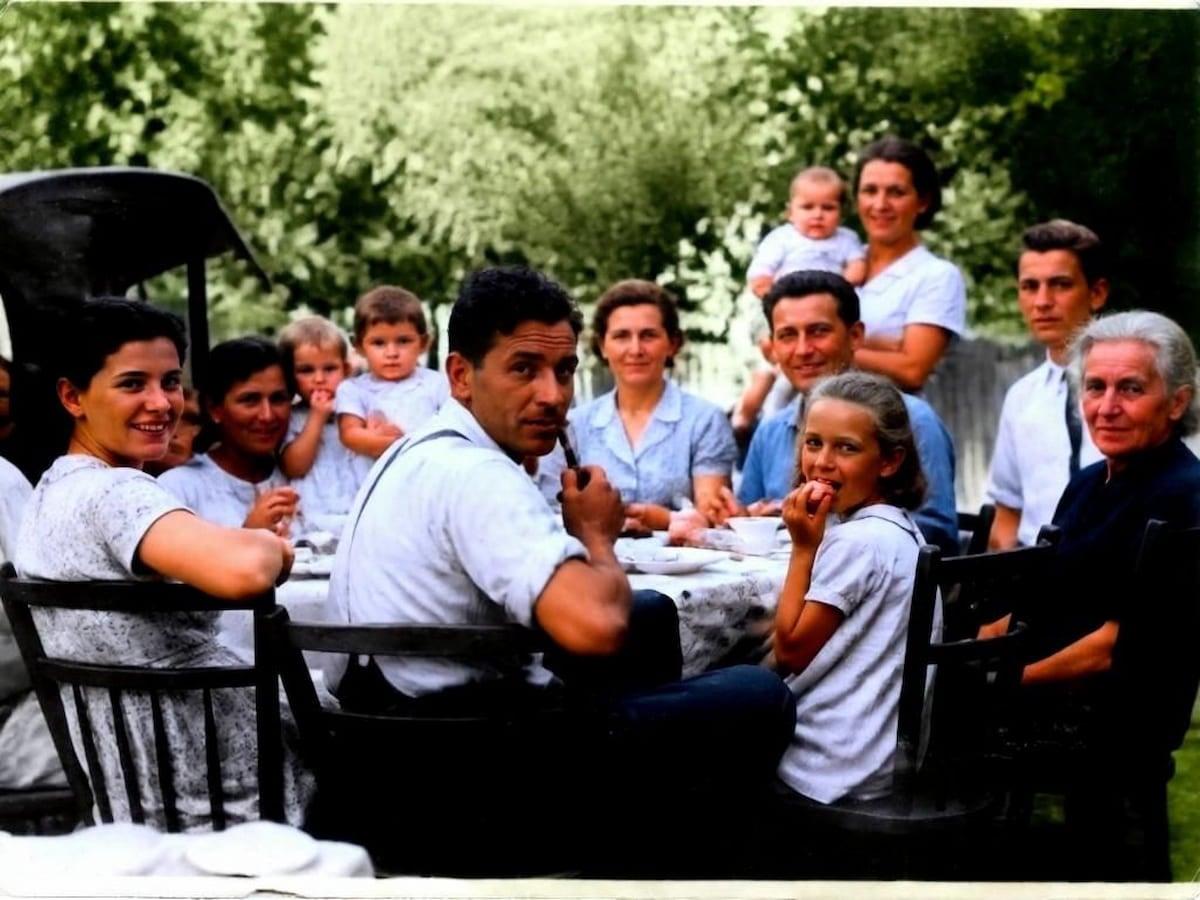 An ai colorized family gathering photo with fotor's ai photo colorizer