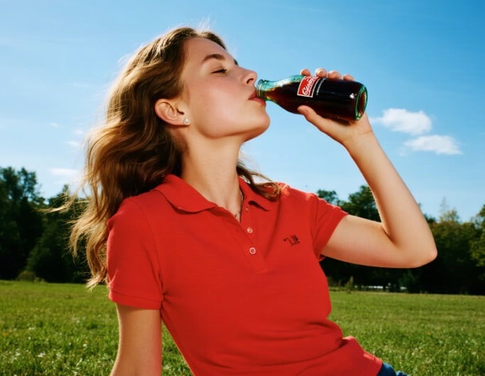 An ai enhanced brightened photo of a woman in a red dress