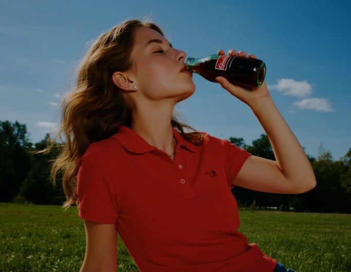 An original photo of a woman in a dark red dress