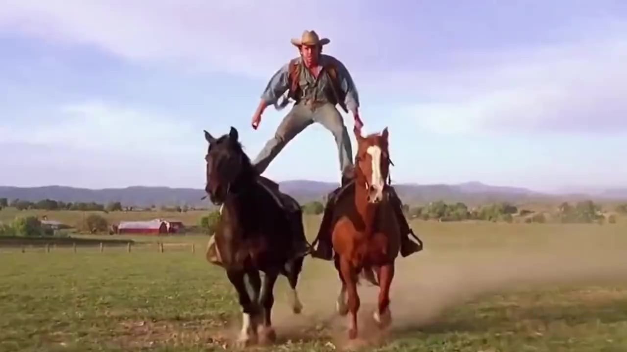 A video of a man riding two horses generated by sora 2 on fotor